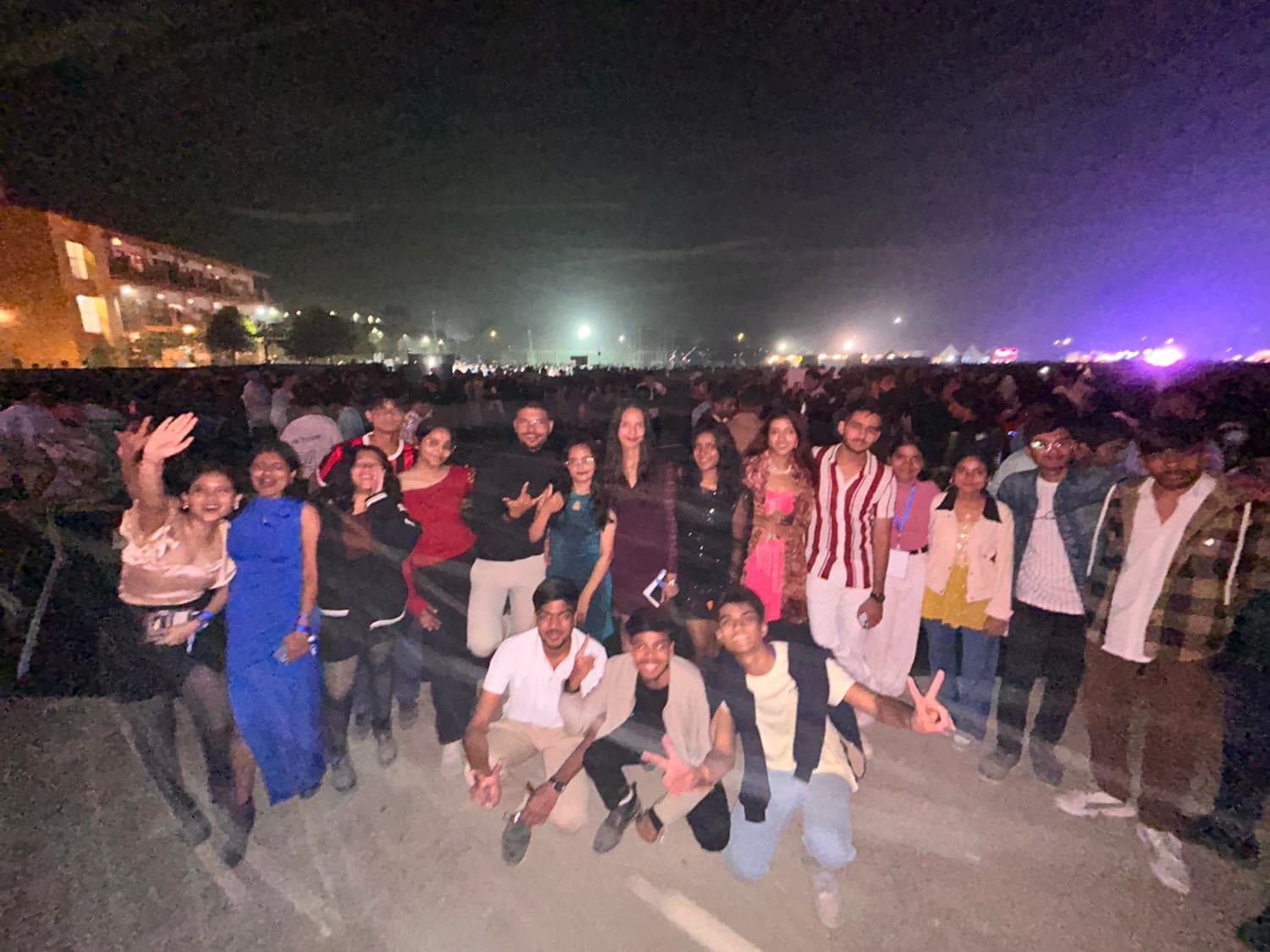 The group on the fest ground with the crowd stretching out behind